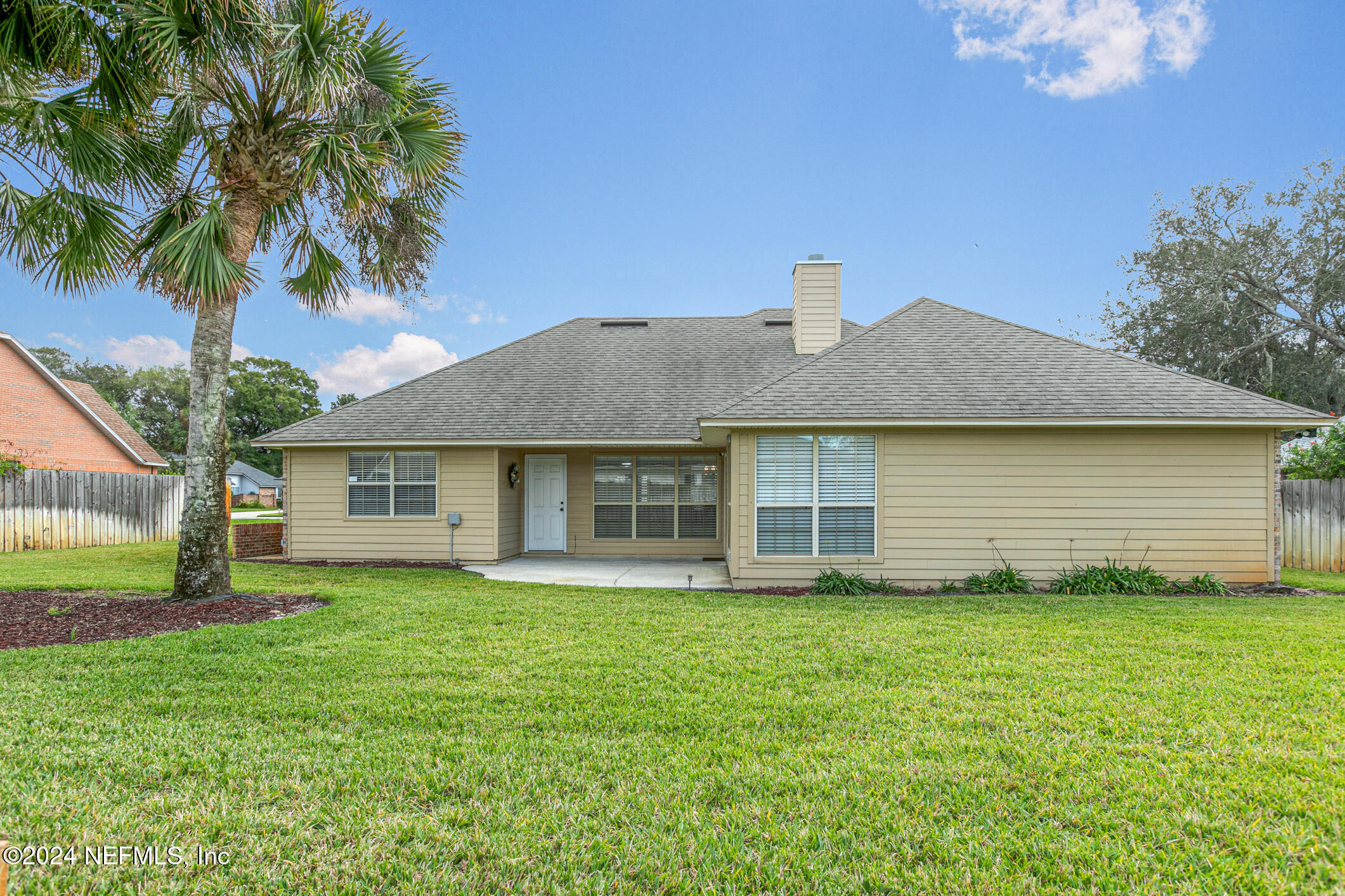 540 Moultrie Wells Road St. Augustine, FL 32086 - Photo 40 of 44 a front view of a house with a garden