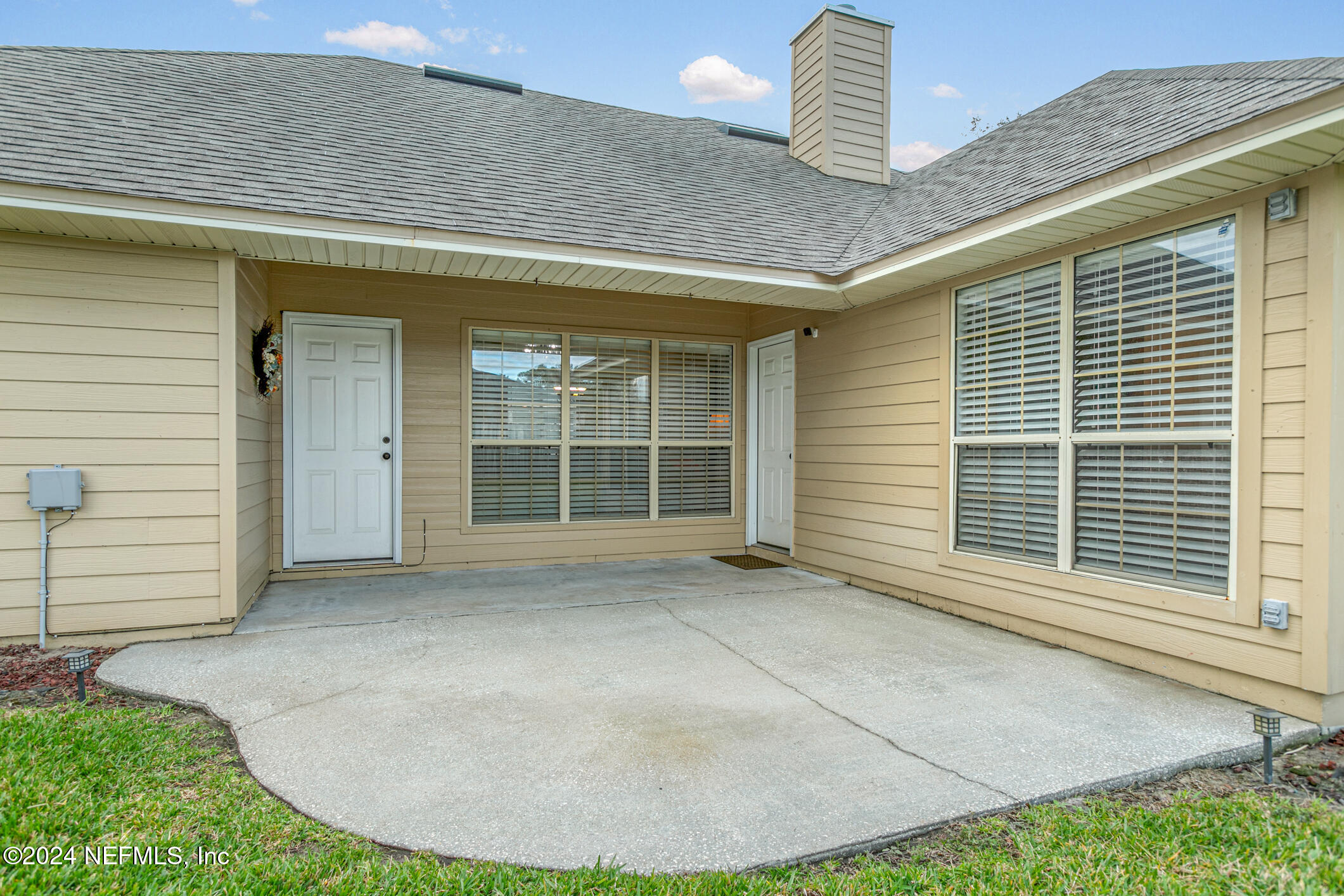 540 Moultrie Wells Road St. Augustine, FL 32086 - Photo 41 of 44 a view of a house with a wooden floor and fence in front of house