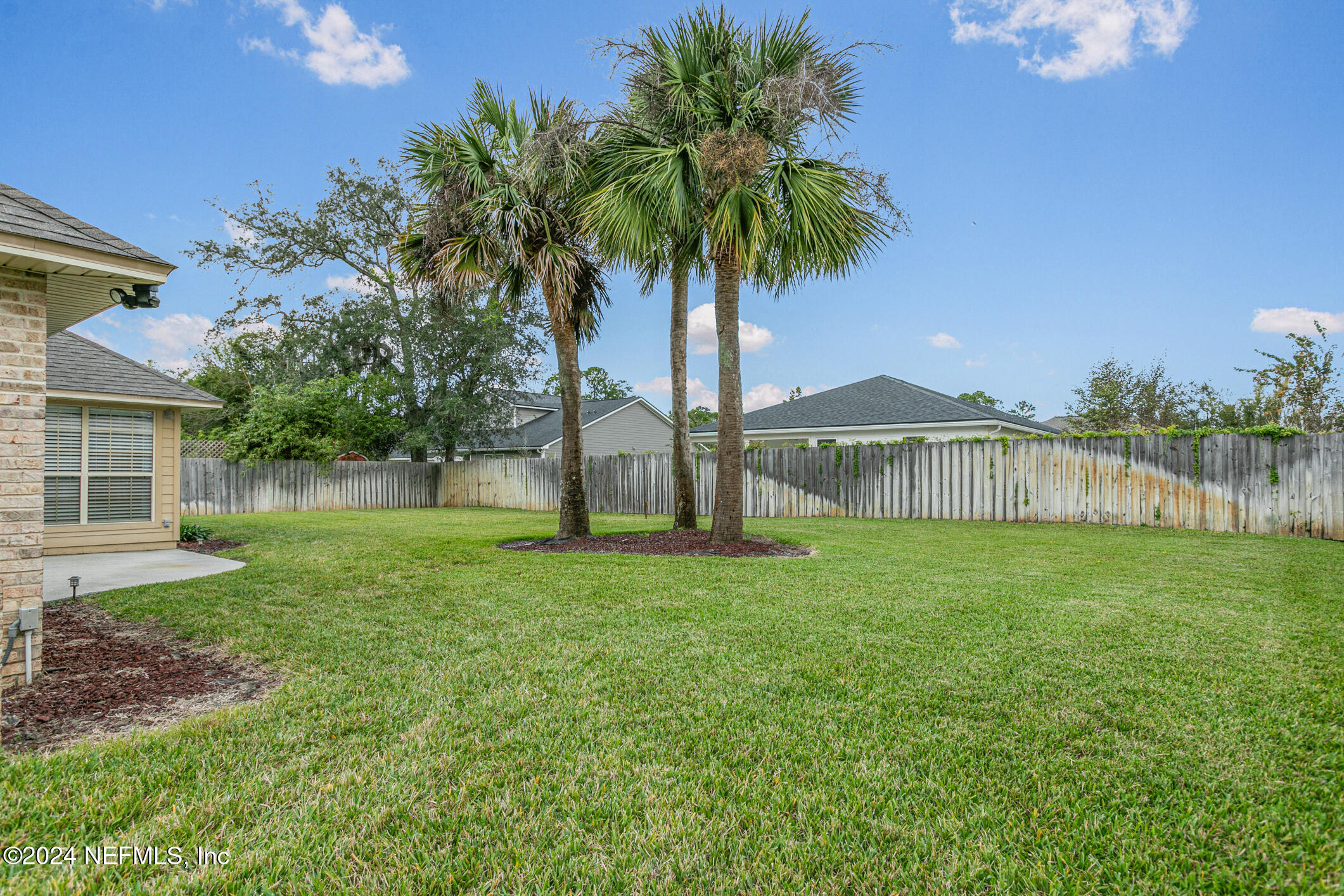 540 Moultrie Wells Road St. Augustine, FL 32086 - Photo 42 of 44 a view of a house with a yard and a garden