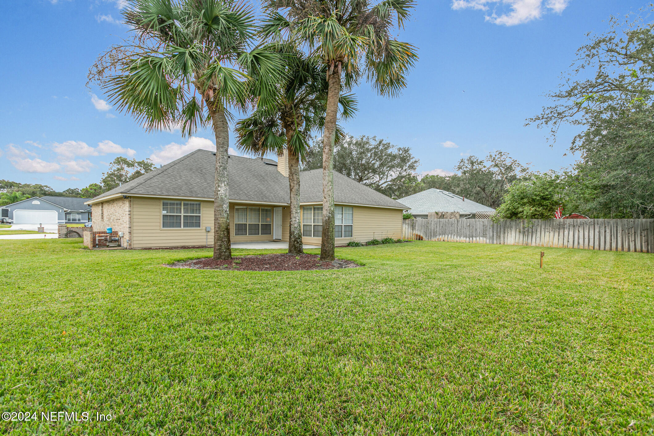 540 Moultrie Wells Road St. Augustine, FL 32086 - Photo 43 of 44 a view of a house with backyard and garden