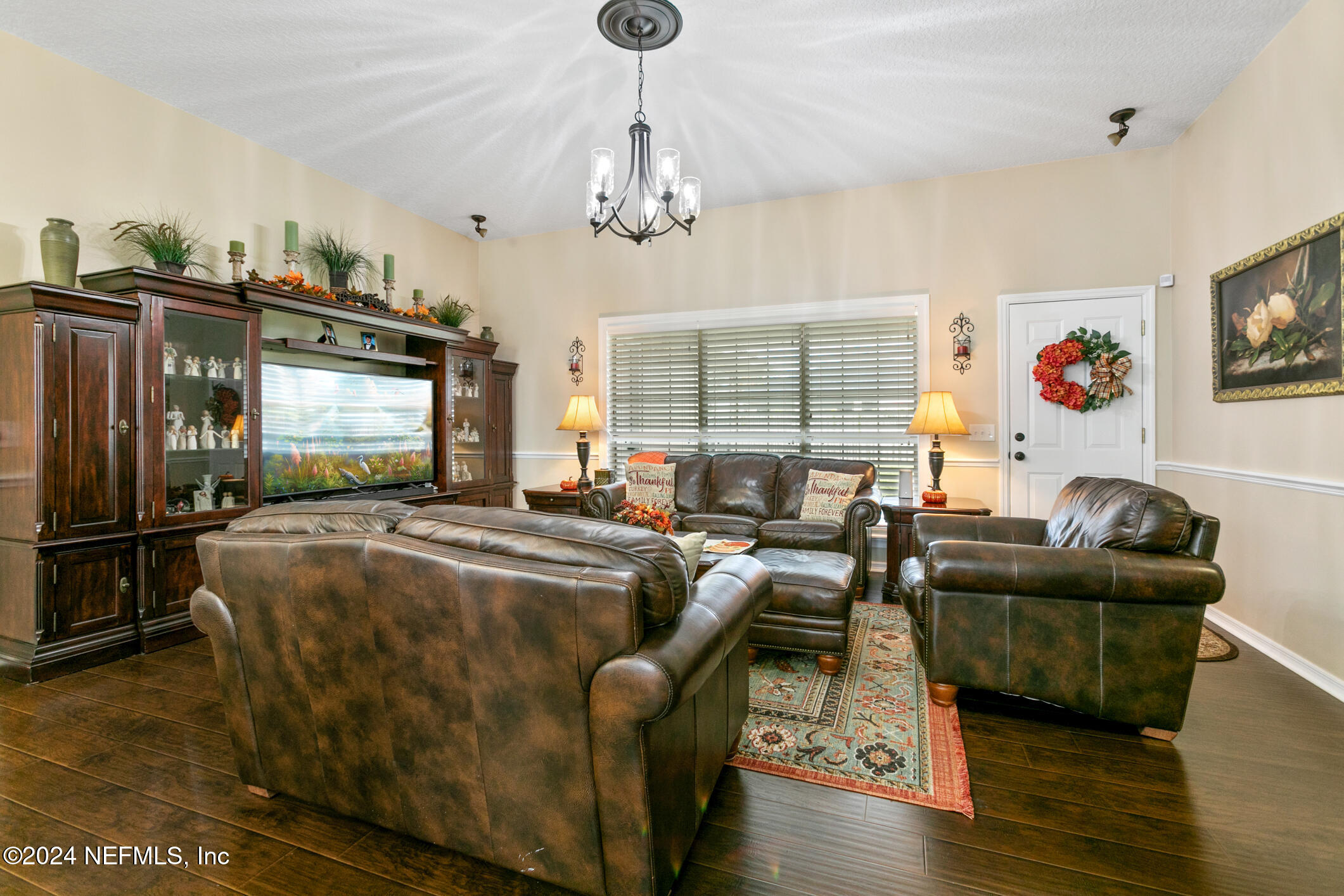 540 Moultrie Wells Road St. Augustine, FL 32086 - Photo 7 of 44 a living room with fireplace furniture and a flat screen tv