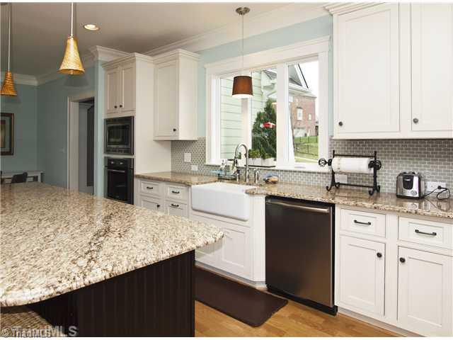 815 Heron Ridge Road Winston-Salem, NC 27106 - Photo 5 of 16 Kitchen. With granite, Bosch appliances, farm sink, exhaust hood & more.