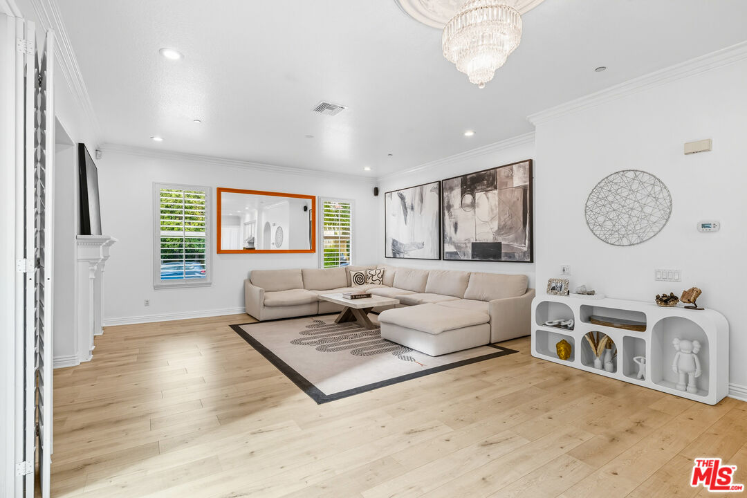 22074 Sagebrook Road Chatsworth, CA 91311 - Photo 16 of 35 a living room with furniture a large window and stainless steel appliances