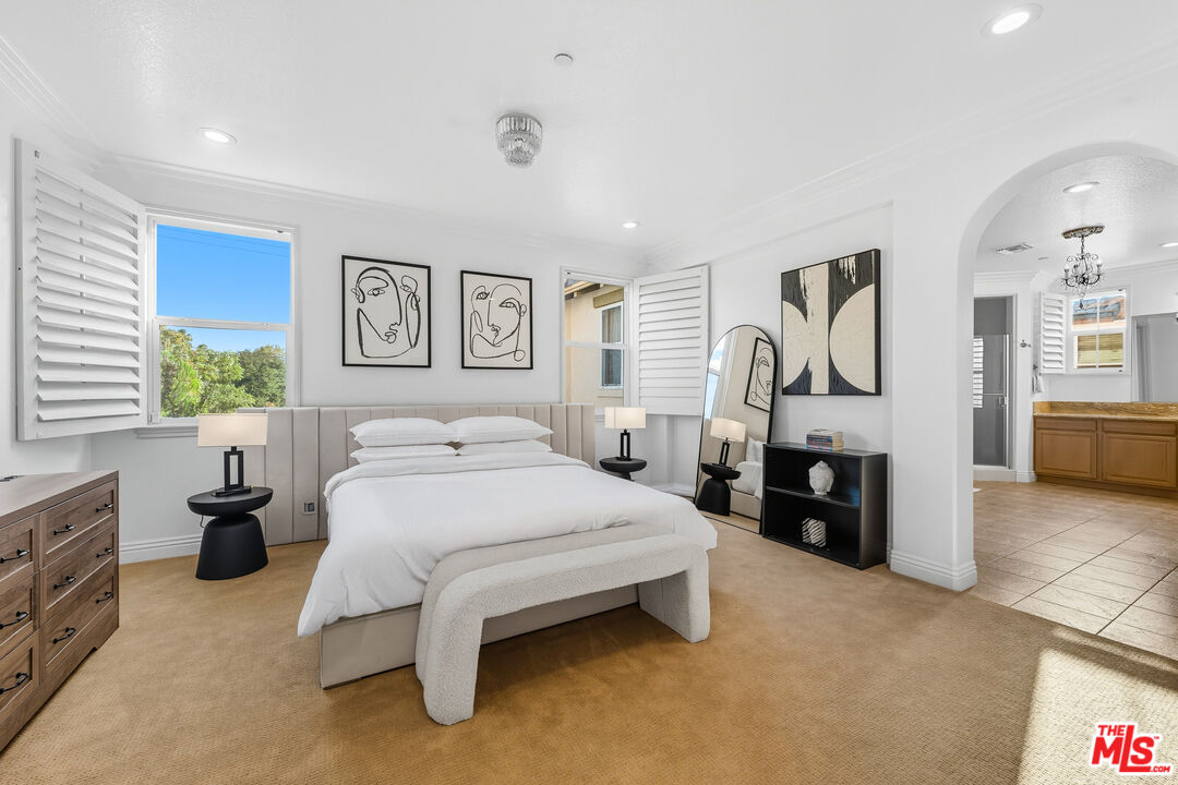 22074 Sagebrook Road Chatsworth, CA 91311 - Photo 26 of 35 a spacious bedroom with a bed and dresser