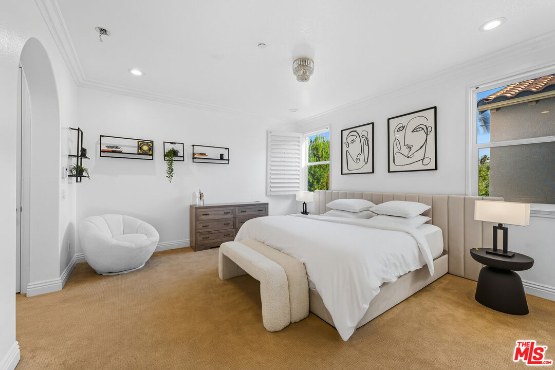 22074 Sagebrook Road Chatsworth, CA 91311 - Photo 27 of 35 a bedroom with a bed and a couch