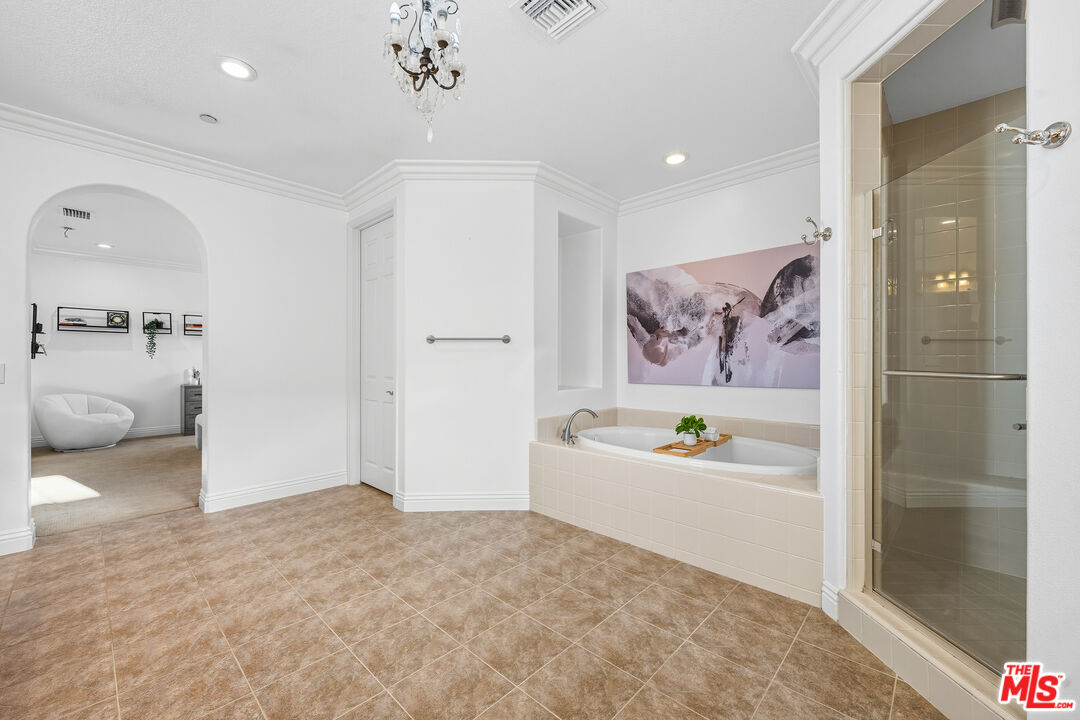 22074 Sagebrook Road Chatsworth, CA 91311 - Photo 30 of 35 a bathroom with a bathtub and a shower