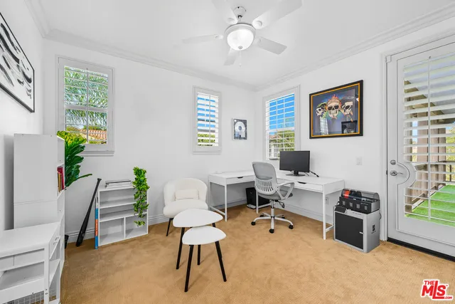 a view of a backyard with sitting area