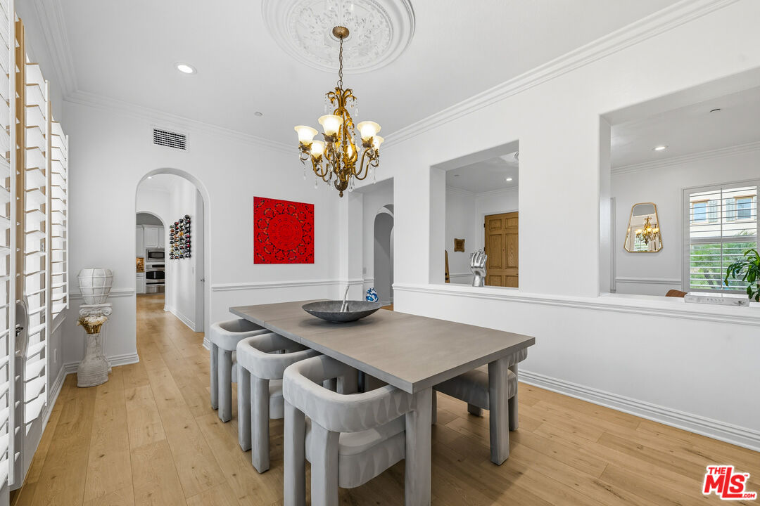 22074 Sagebrook Road Chatsworth, CA 91311 - Photo 6 of 35 a view of a dining room with furniture and wooden floor