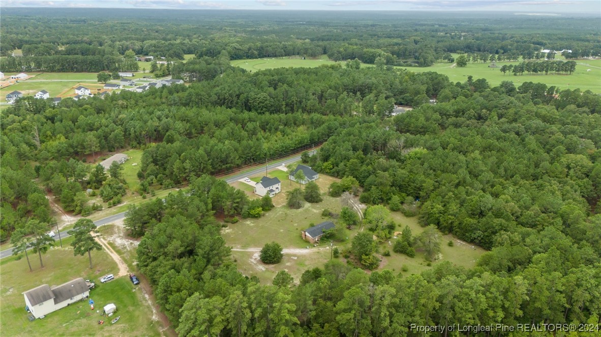 2902 Calloway (lot 1) Road Raeford, NC 28376 - Photo 11 of 44 a view of a city with lush green forest