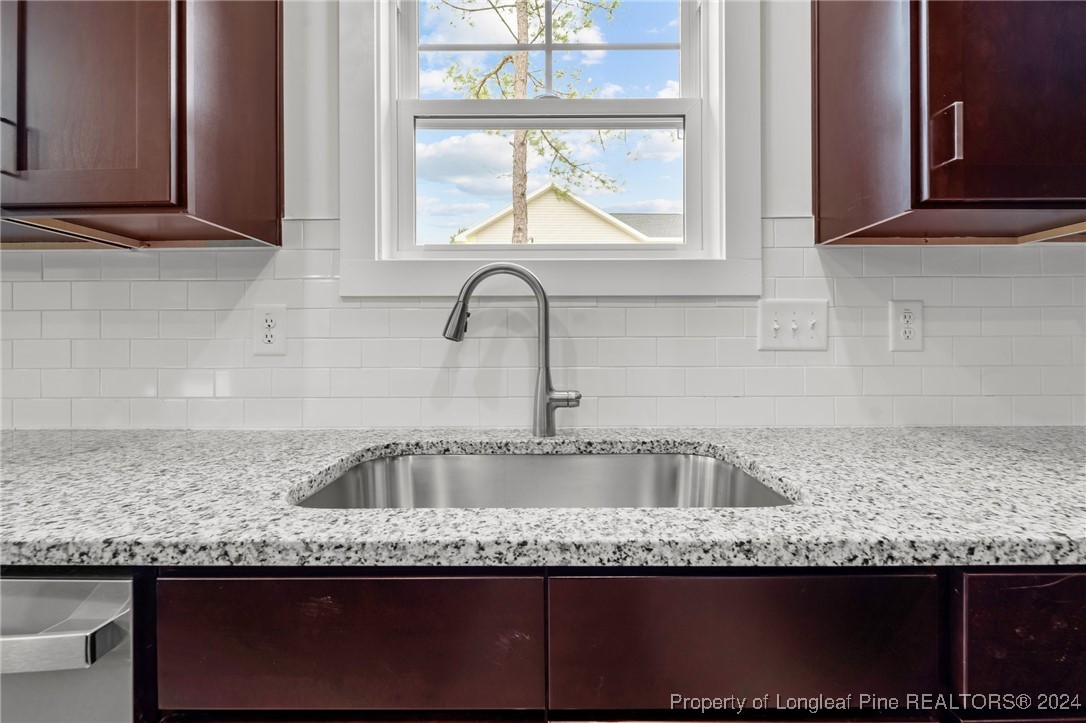 2902 Calloway (lot 1) Road Raeford, NC 28376 - Photo 24 of 44 a kitchen with granite countertop a sink and a window