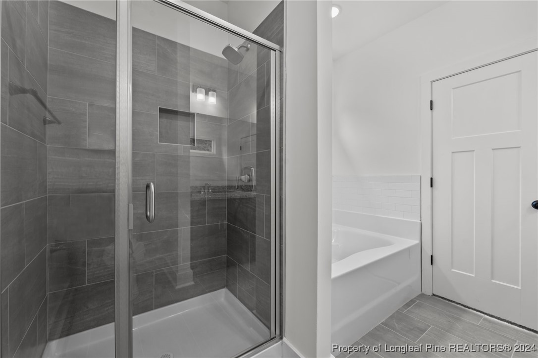 2902 Calloway (lot 1) Road Raeford, NC 28376 - Photo 31 of 44 a bathroom with a glass shower door