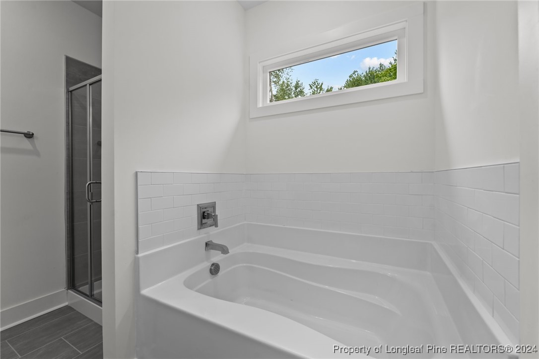 2902 Calloway (lot 1) Road Raeford, NC 28376 - Photo 32 of 44 a white bath tub sitting next to a white sink