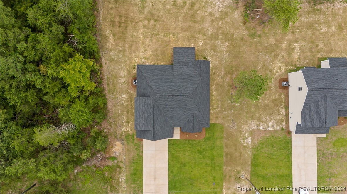 2902 Calloway (lot 1) Road Raeford, NC 28376 - Photo 7 of 44 aerial view of a brick house next to a yard