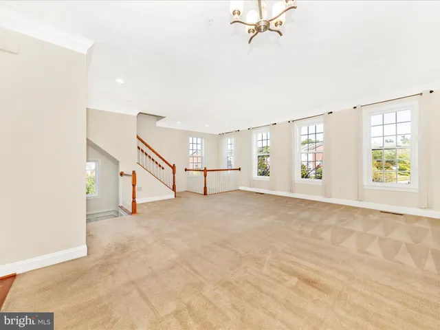 a view of a livingroom with furniture and a chandelier