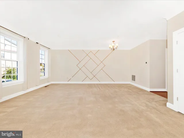 a view of kitchen with wooden floor and electronic appliances