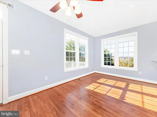 a large kitchen with granite countertop a large counter top stainless steel appliances and cabinets