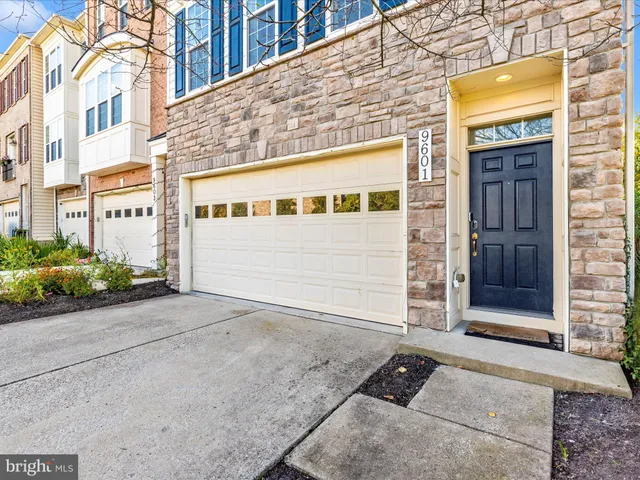 a front view of a building with garage