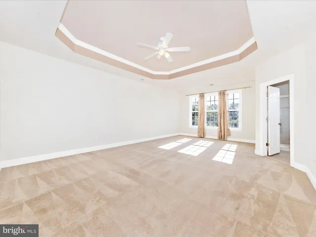a white bath tub sitting next to a window