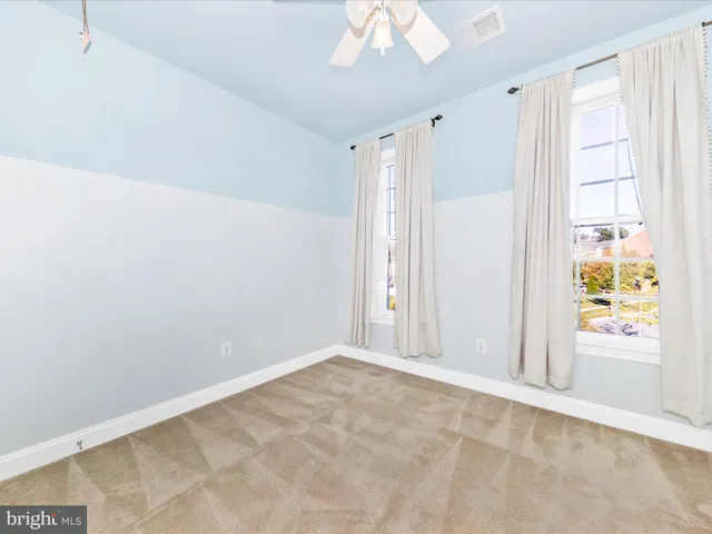 a view of a chairs in back of the house