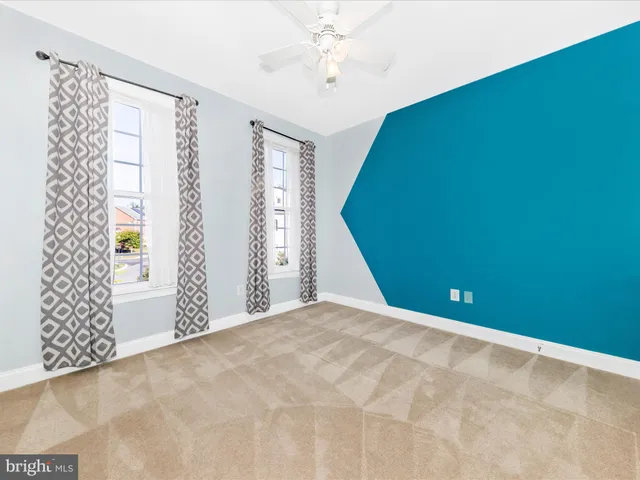 a view of a balcony with wooden floor and fence