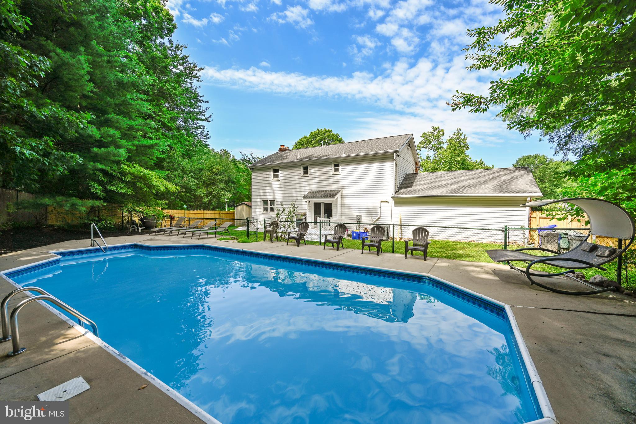 2116 Kings House Road Silver Spring, MD 20905 - Photo 6 of 37 a view of a swimming pool with lounge chair
