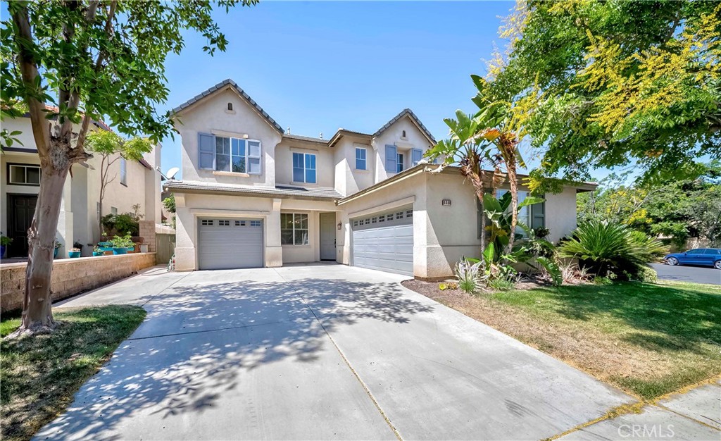 4498 Driving Range Road Corona, CA 92883 - Photo 1 of 1 a front view of a house with a yard and garage