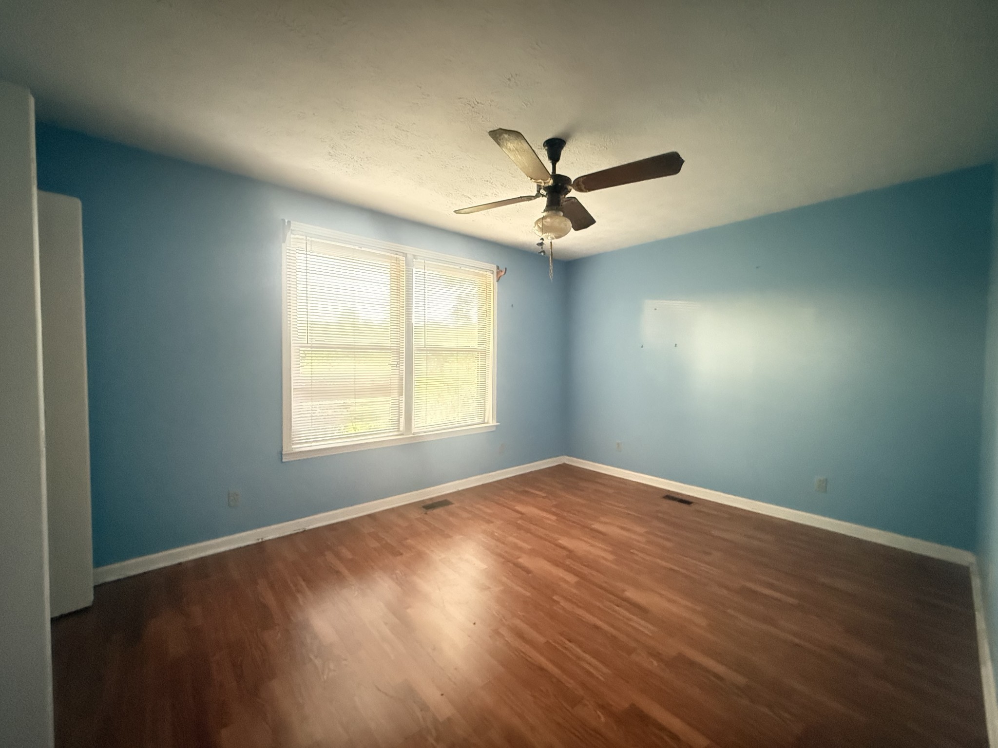 191 Cooks Rd Extension Lebanon, TN 37087 - Photo 13 of 33 a view of empty room with wooden floor and fan