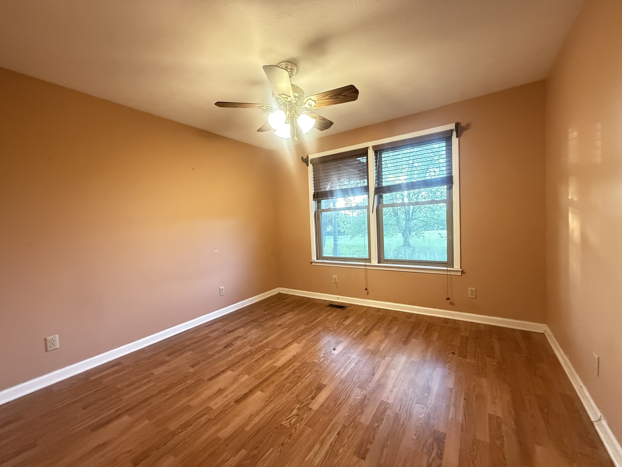 191 Cooks Rd Extension Lebanon, TN 37087 - Photo 10 of 33 a view of an empty room with wooden floor and a window
