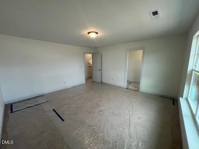 a view of an empty room and window