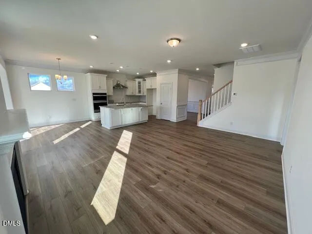 a view of kitchen with cabinets and wooden floor