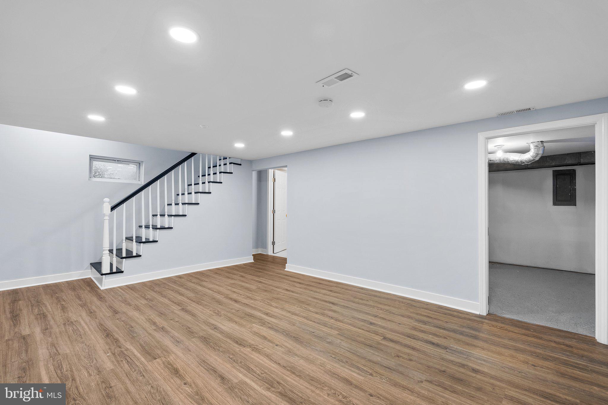 208 Granville Drive Silver Spring, MD 20901 - Photo 26 of 38 Large rec room with utility area off the back