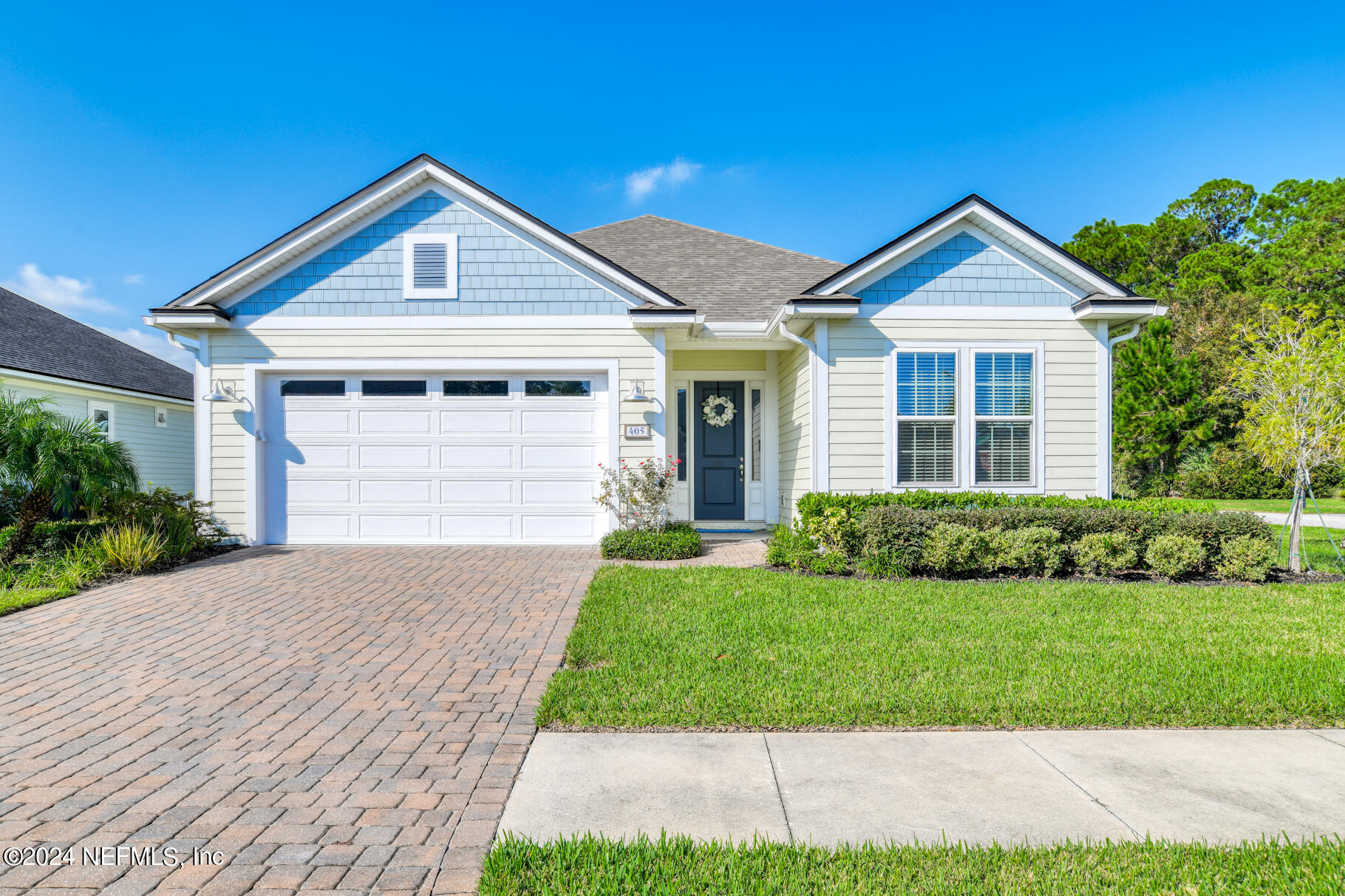 405 Pintoresco Drive St. Augustine, FL 32095 - Photo 1 of 51 a front view of a house with a yard and garage