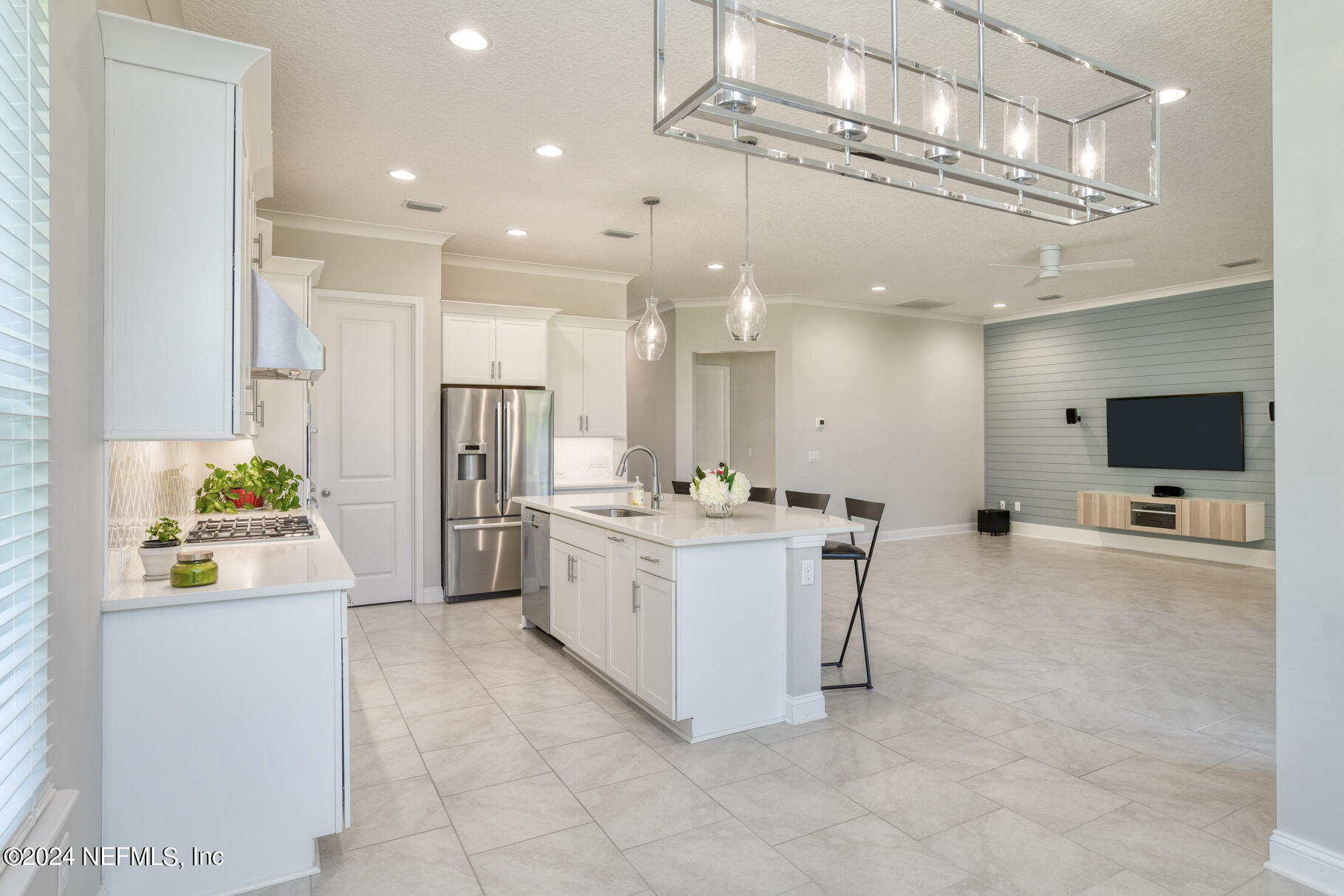 405 Pintoresco Drive St. Augustine, FL 32095 - Photo 16 of 51 a kitchen with a sink a counter top space stainless steel appliances and a chandelier