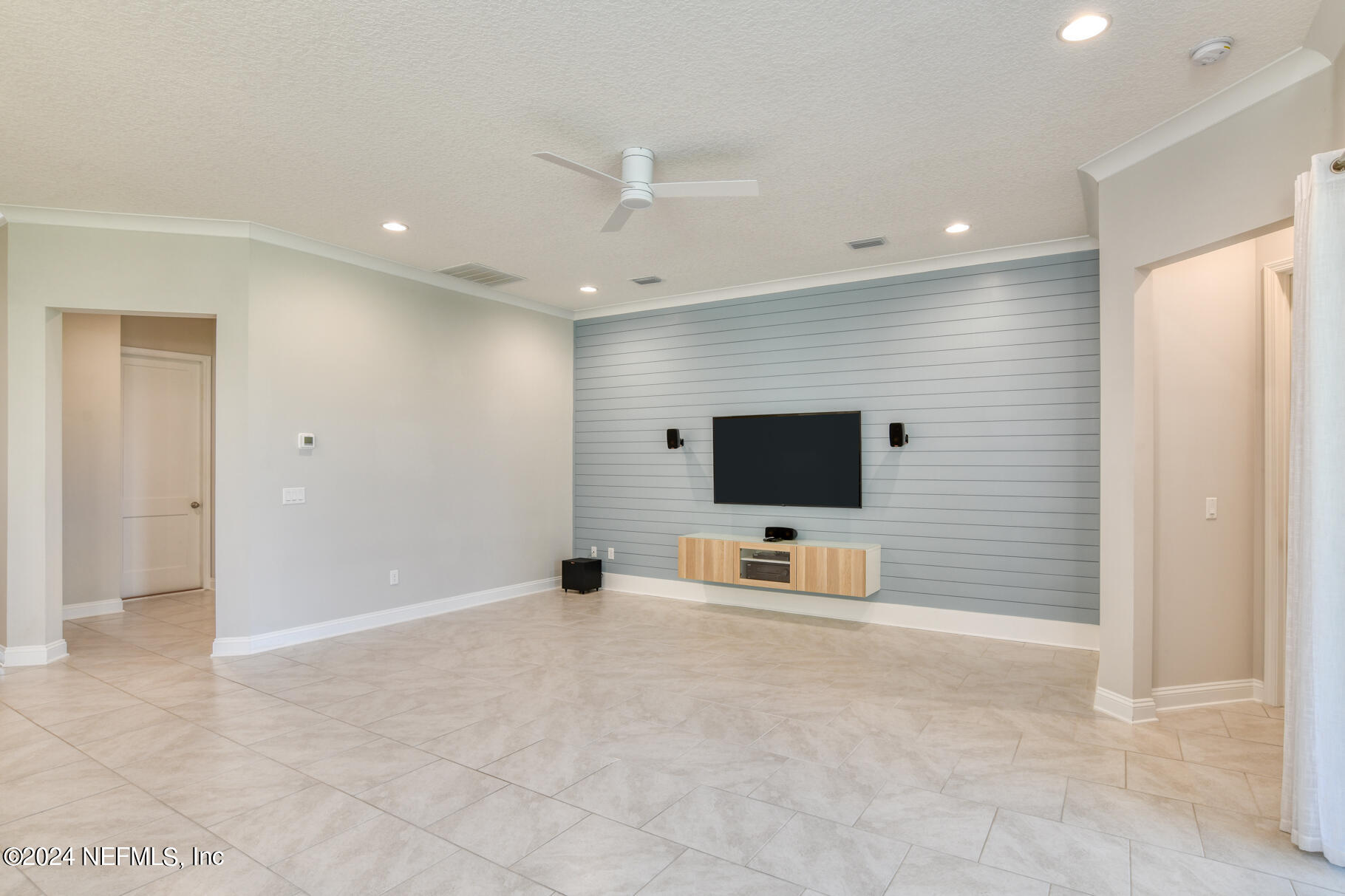 405 Pintoresco Drive St. Augustine, FL 32095 - Photo 18 of 51 a view of a livingroom with a flat screen tv