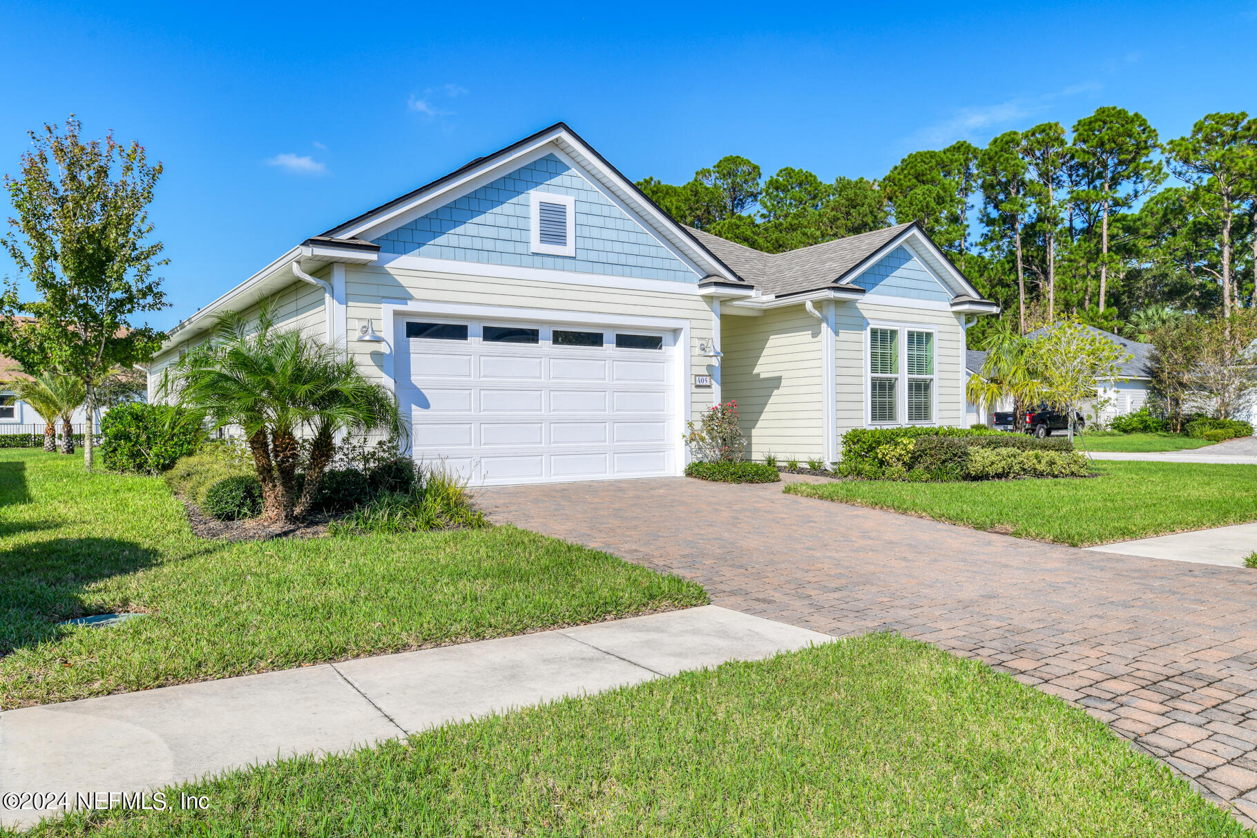 405 Pintoresco Drive St. Augustine, FL 32095 - Photo 2 of 51 a front view of a house with a yard