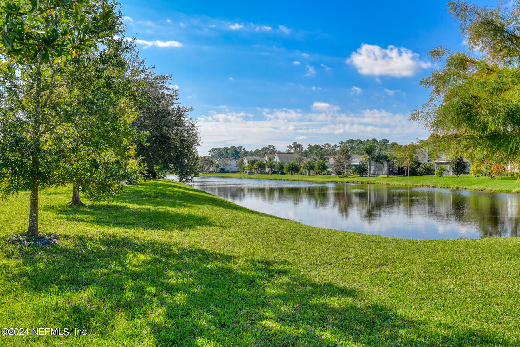 405 Pintoresco Drive St. Augustine, FL 32095 - Photo 27 of 51 a view of a lake with a yard