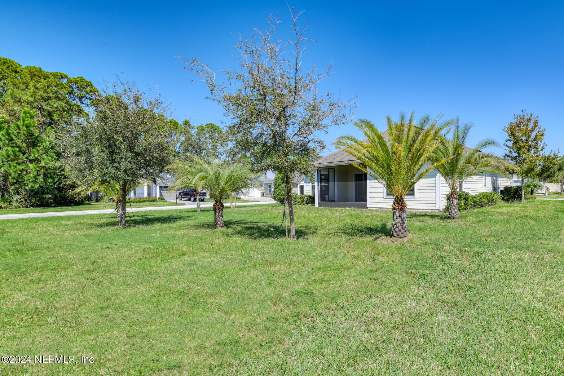 405 Pintoresco Drive St. Augustine, FL 32095 - Photo 30 of 51 a view of a house with a yard