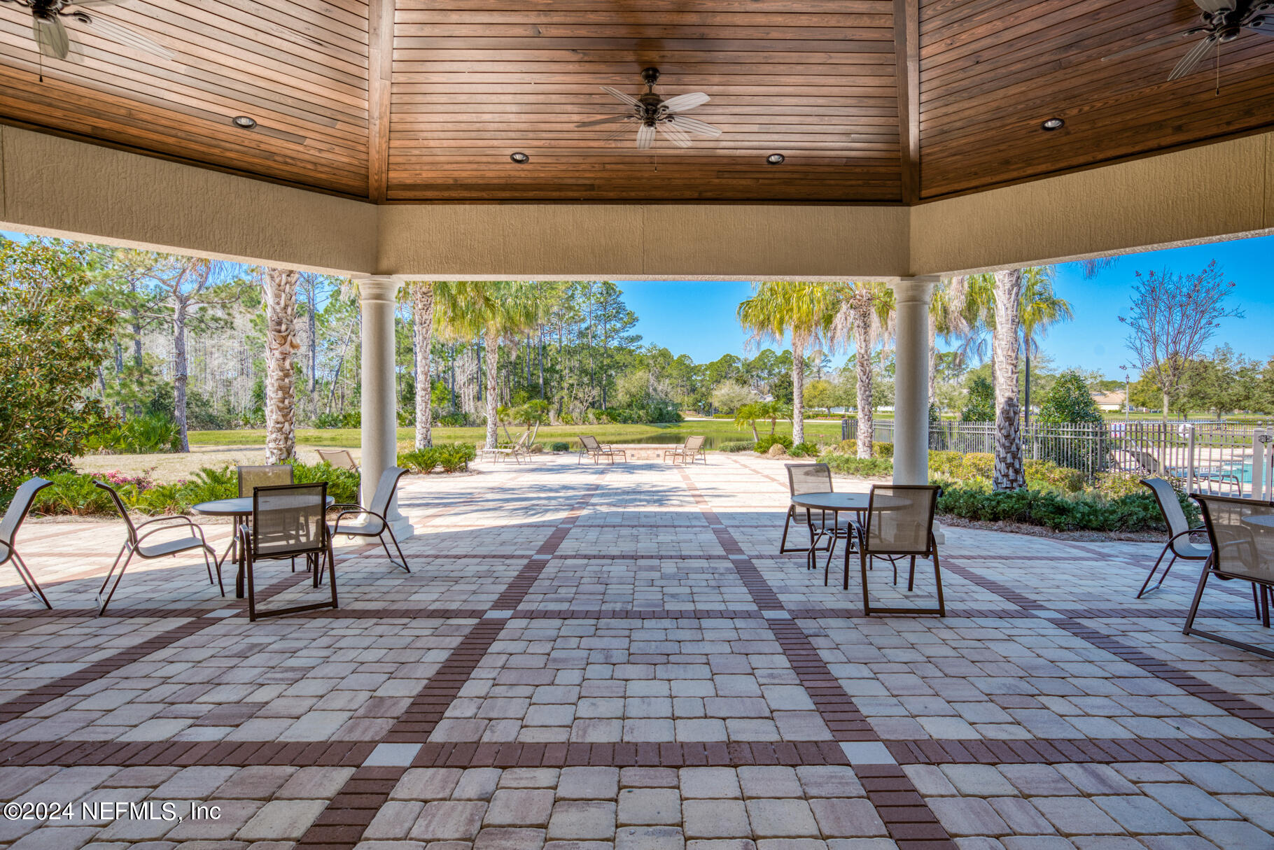405 Pintoresco Drive St. Augustine, FL 32095 - Photo 50 of 51 a view of a patio with a dining table and chairs