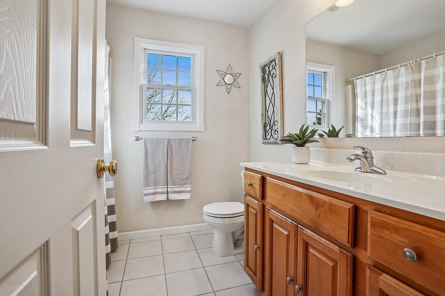 385 Coventry Lane Crete, IL 60417 - Photo 17 of 24 a bathroom with a sink a toilet and a mirror