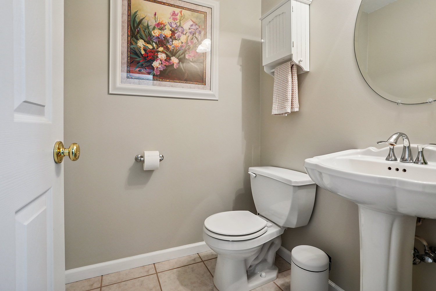 385 Coventry Lane Crete, IL 60417 - Photo 20 of 24 a white toilet sitting next to a bathroom sink