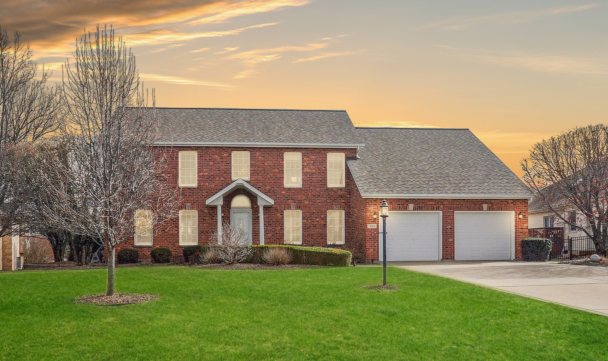 385 Coventry Lane Crete, IL 60417 - Photo 24 of 24 a front view of a house with a garden