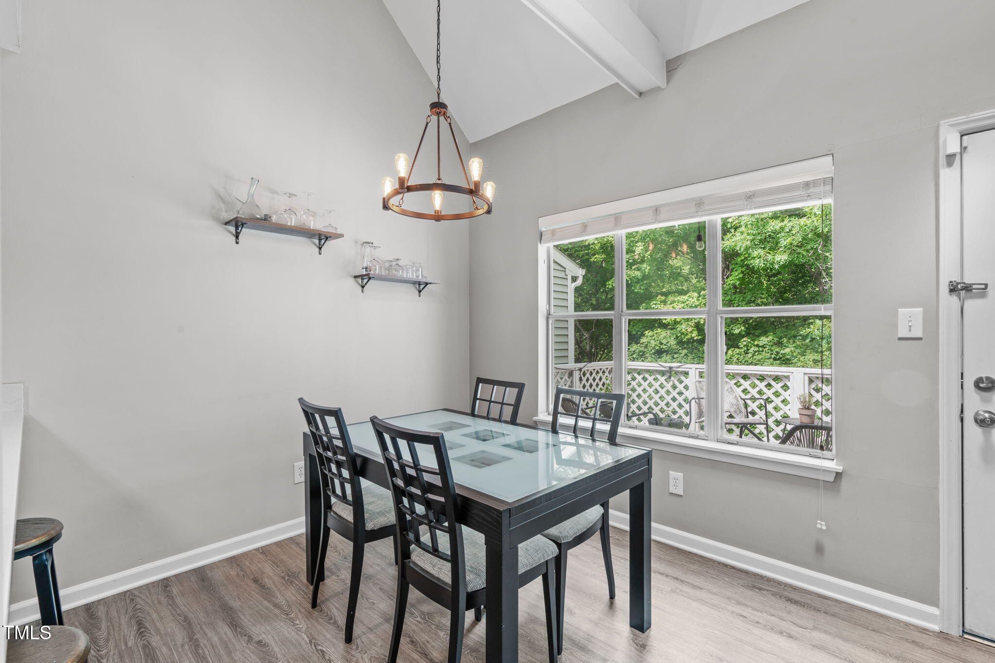405 Gooseneck Drive, Unit B6 Cary, NC 27513 - Photo 12 of 26 a view of a dining room with furniture window and wooden floor