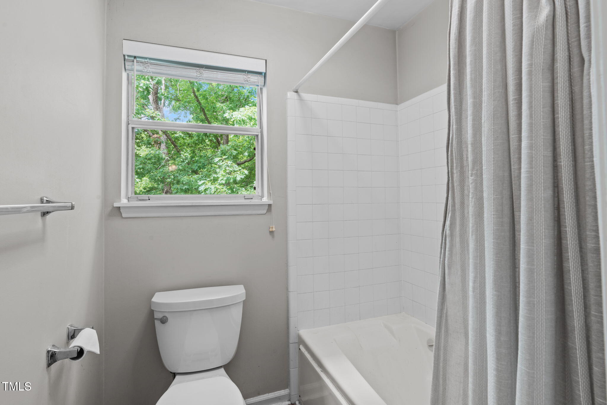 405 Gooseneck Drive, Unit B6 Cary, NC 27513 - Photo 17 of 26 a bathroom with a toilet and a shower