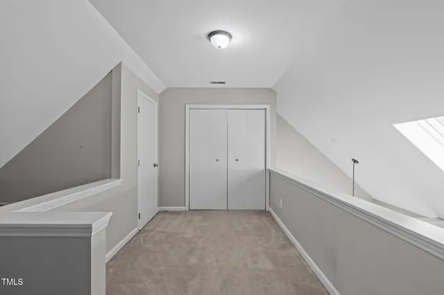 a bedroom with a bed and a table