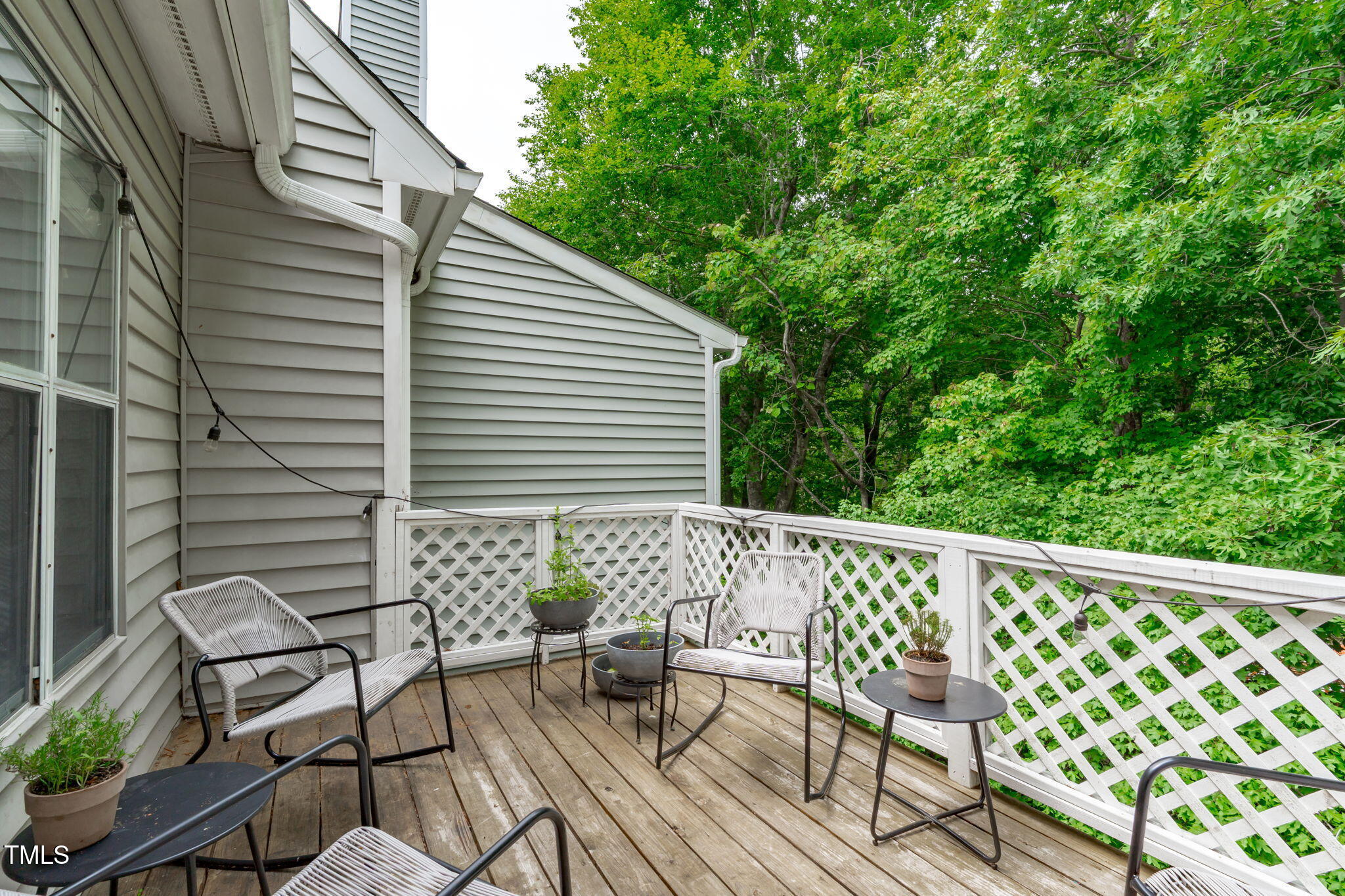 405 Gooseneck Drive, Unit B6 Cary, NC 27513 - Photo 22 of 26 a view of balcony with wooden floor and outdoor seating