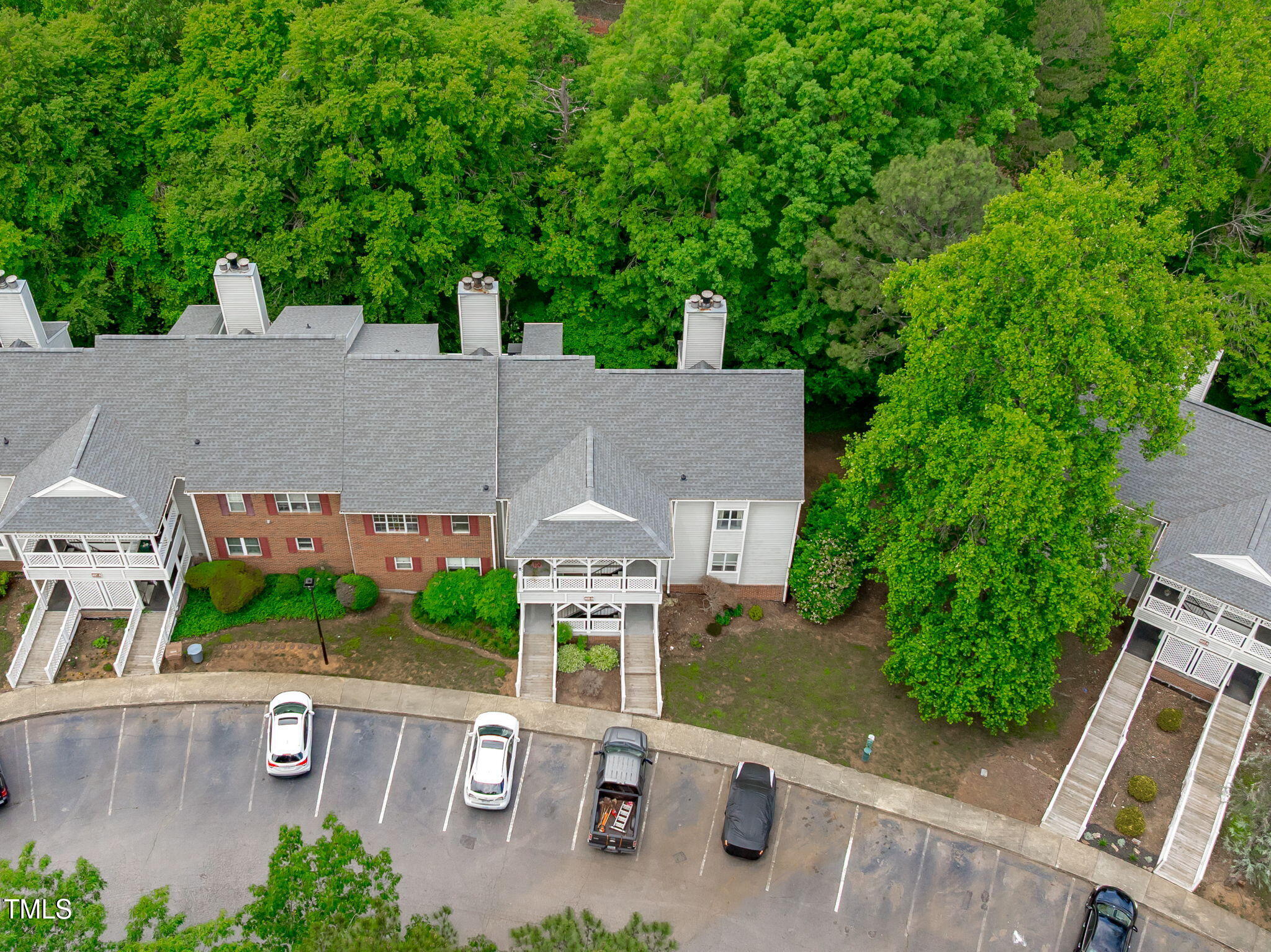 405 Gooseneck Drive, Unit B6 Cary, NC 27513 - Photo 24 of 26 an aerial view of a house with a garden