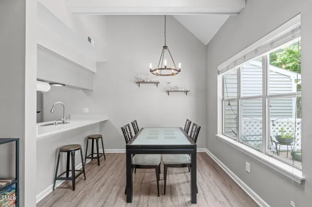 a kitchen with stainless steel appliances a stove a microwave and a refrigerator