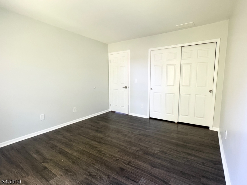 76 Jamestown Road Bernards, NJ 07920 - Photo 9 of 20 a view of an empty room with wooden floor