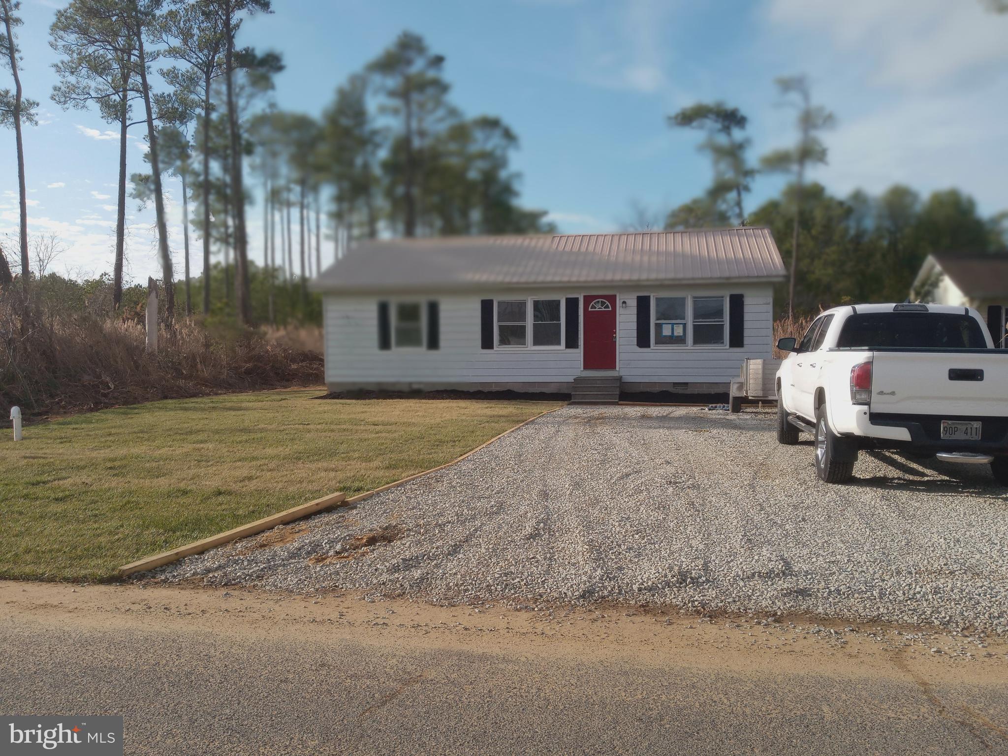 2990 Byrdtown Road Crisfield, MD 21817 - Photo 3 of 8 a front view of a house with garden