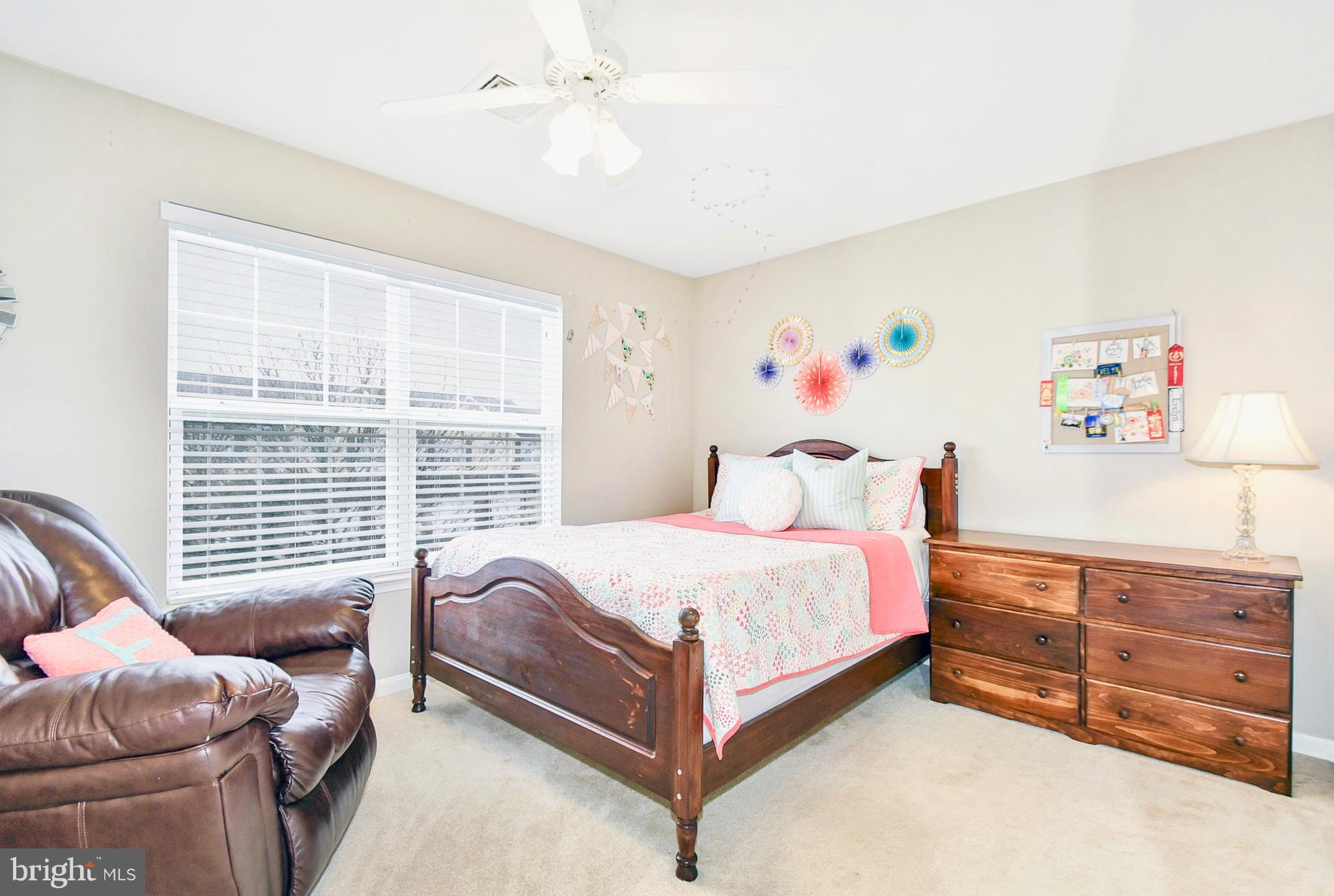 102 Peregrine Lane Hummelstown, PA 17036 - Photo 15 of 28 a bedroom with a bed and a couch